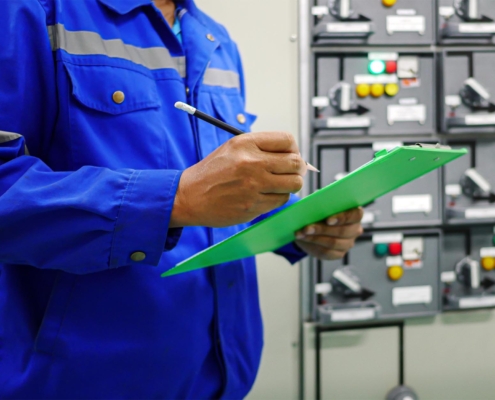 Electrical maintenance technician visual inspection electrical control cabinets