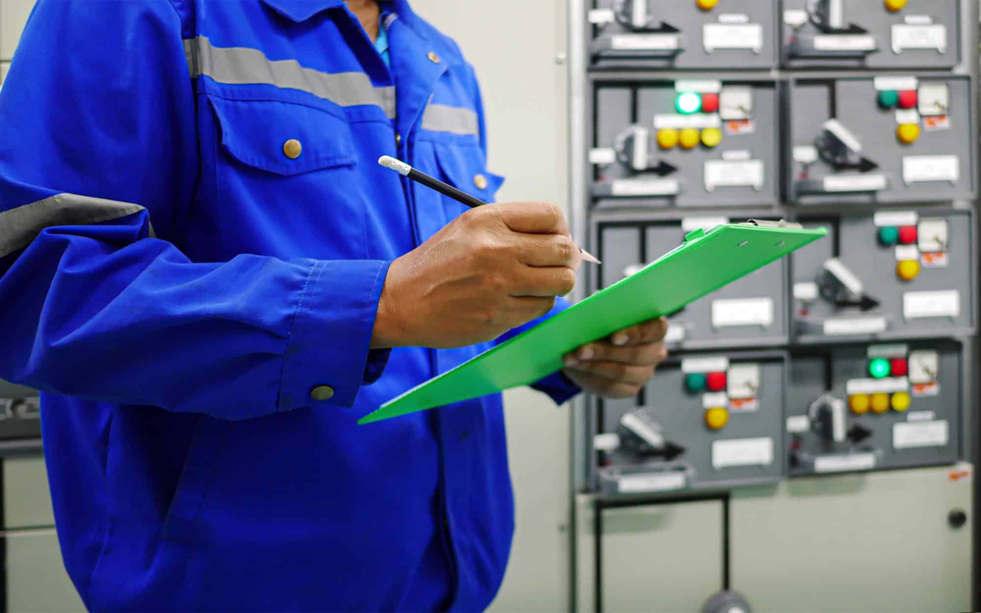 Electrical maintenance technician visual inspection electrical control cabinets