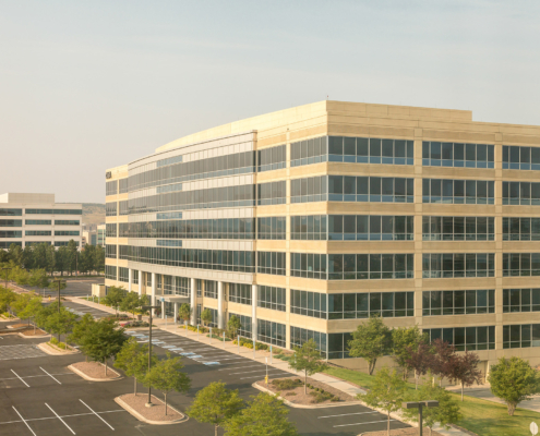 Wide view of White Concrete Office Building with Black Windows