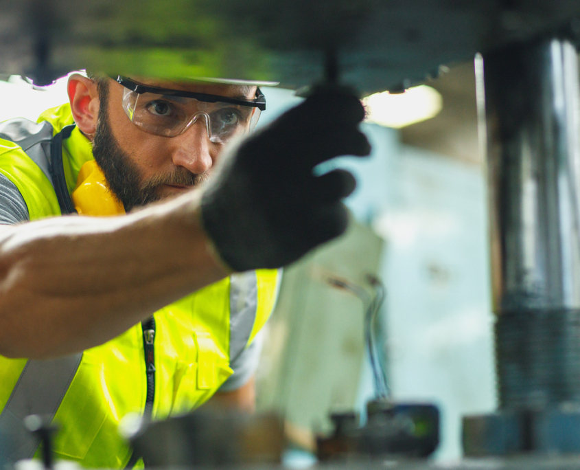 Side view of man in industrial plant