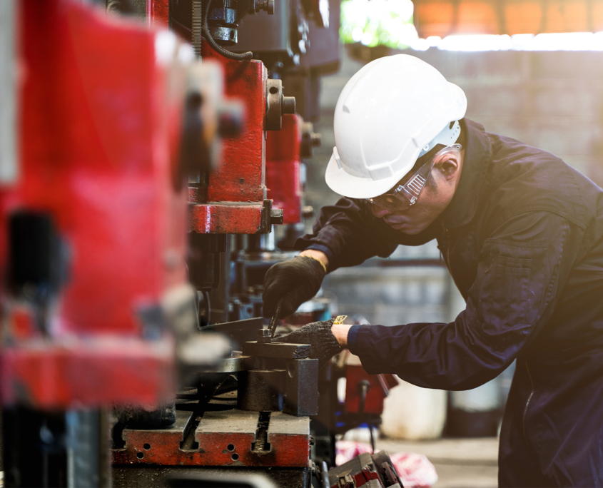 Side view of mechanical worker doing maintenance